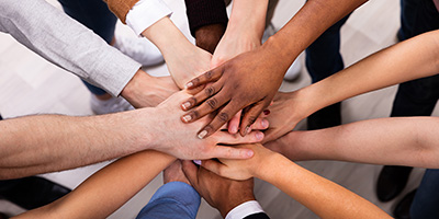 High Angle View Of Multiracial Friend Stacking Hand Together