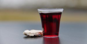 clear drinking glass with red liquid