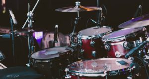 selective focus photography of red drum set